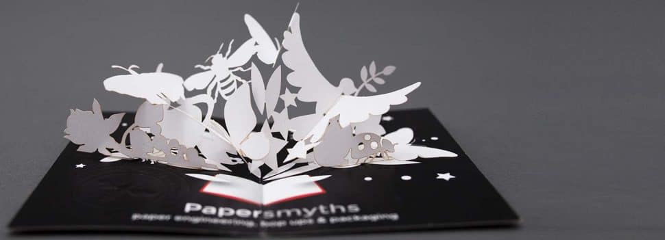 Our pop-up business card featuring paper flowers, birds, bees and butterflies